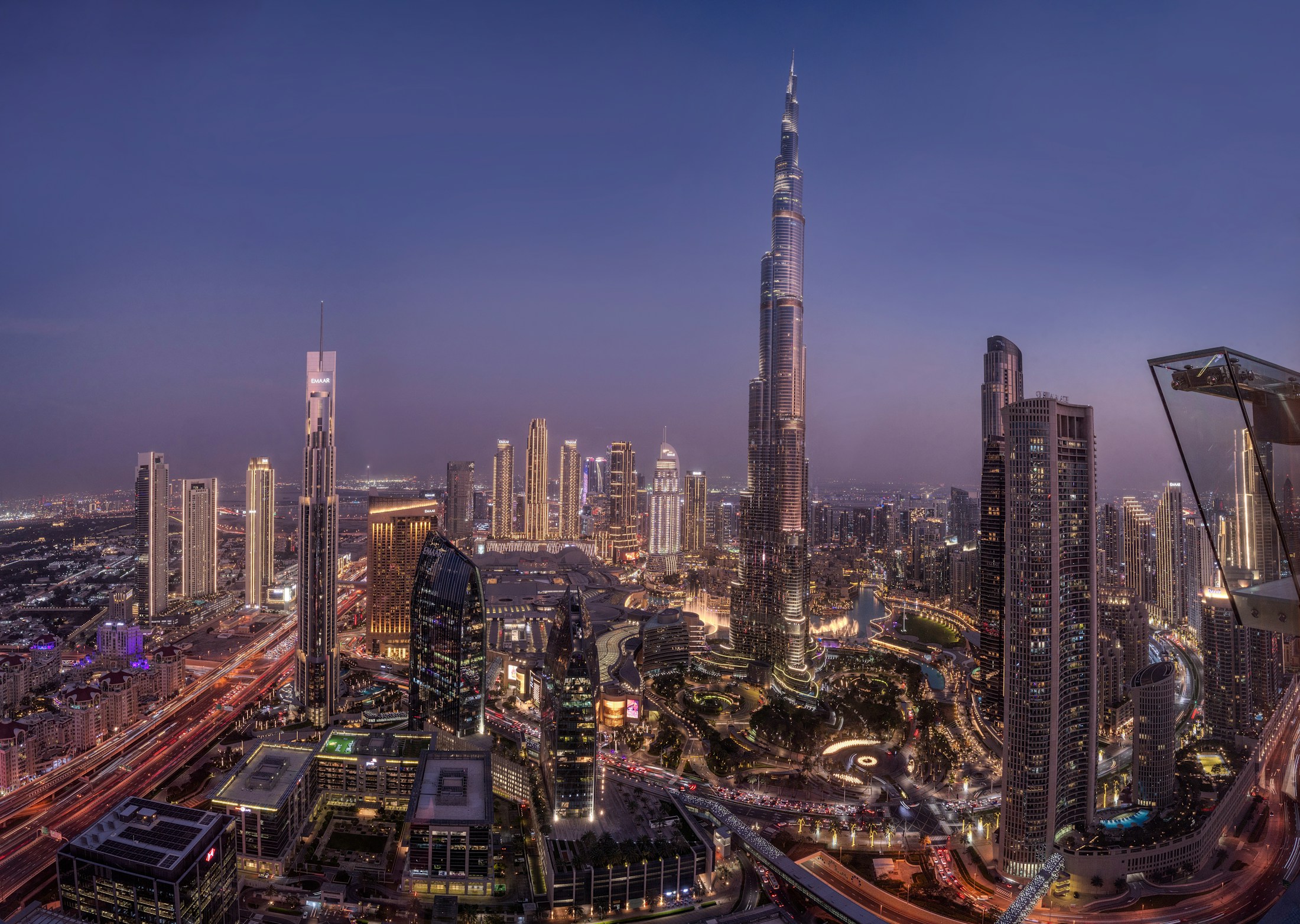 Burj Khalifa and the illuminated Downtown Dubai skyline at twilight